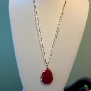 Long necklace with red stone pendant